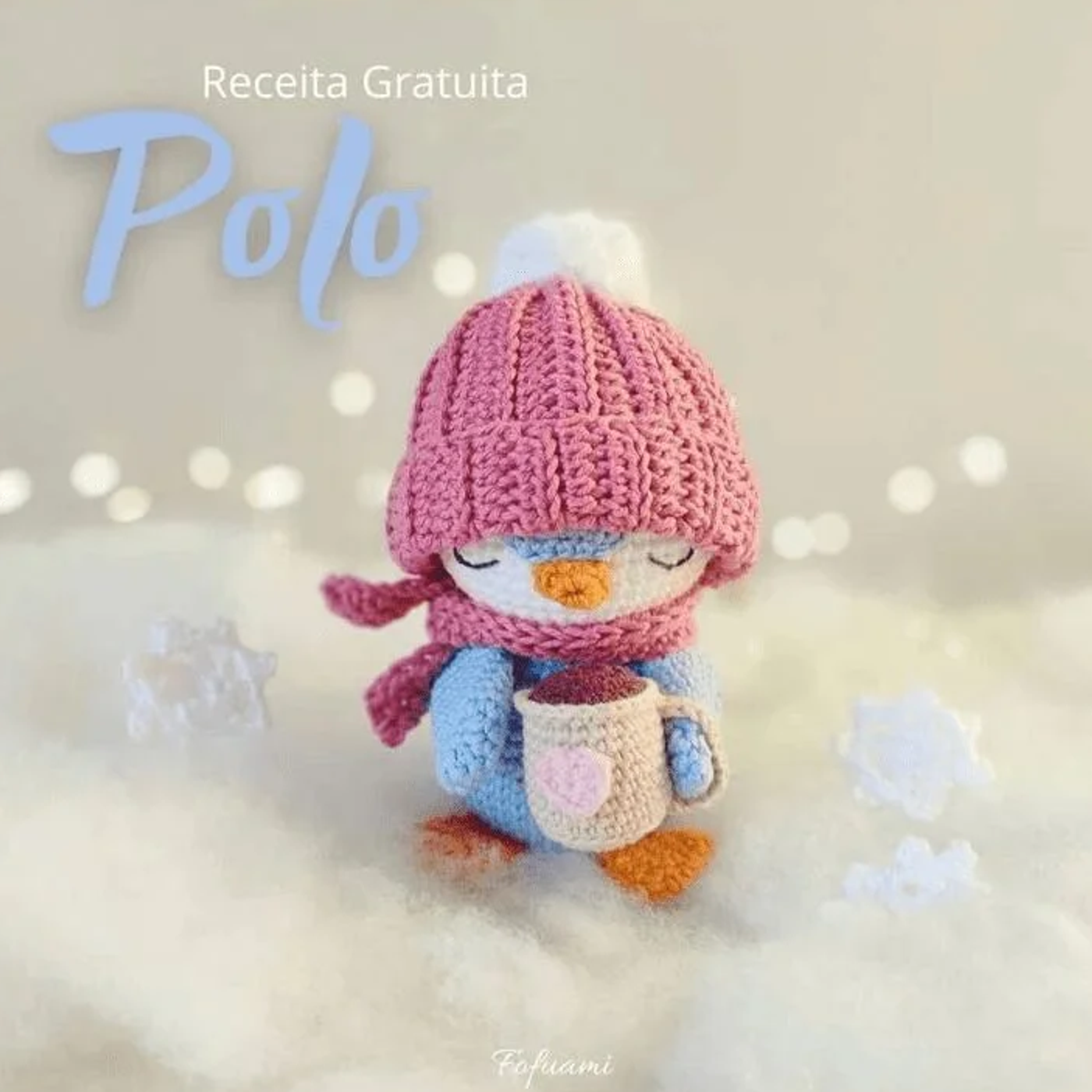 Pingüino amigurumi bebé llamado Polo tejido a crochet con gorro rosa y cuerpo azul