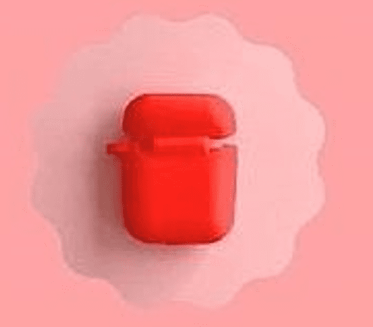 Un Estuche Rojo Con La Tapa Abierta Probablemente Para Auriculares Inalámbricos Está Centrado Sobre Un Fondo Circular Festoneado De Color Rosa Claro